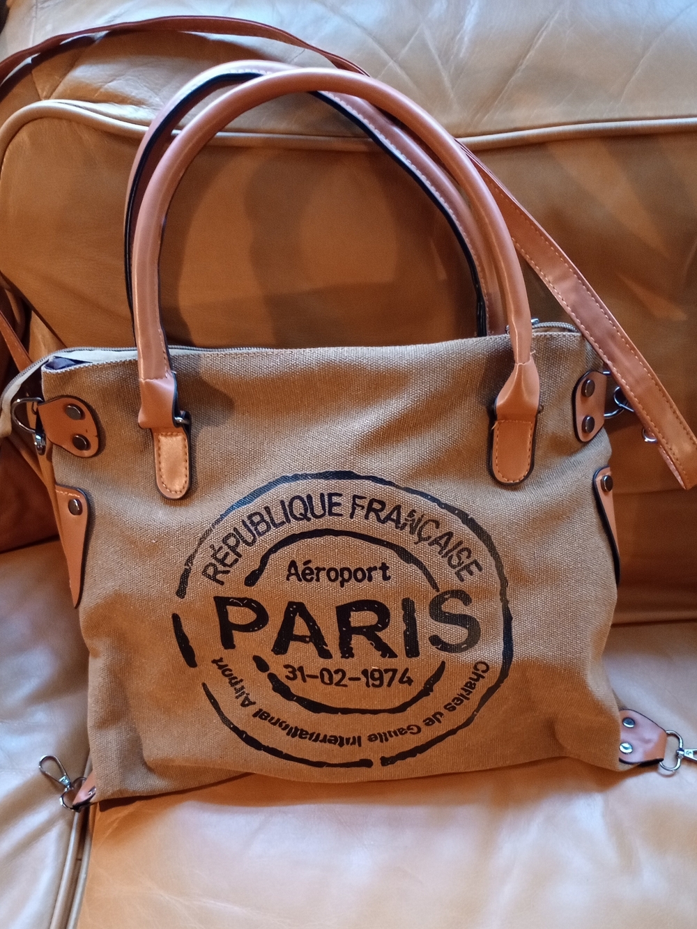 Spring Summer** Paris Printed Handbag In Tan And The Fabric Is Canvas. NEW